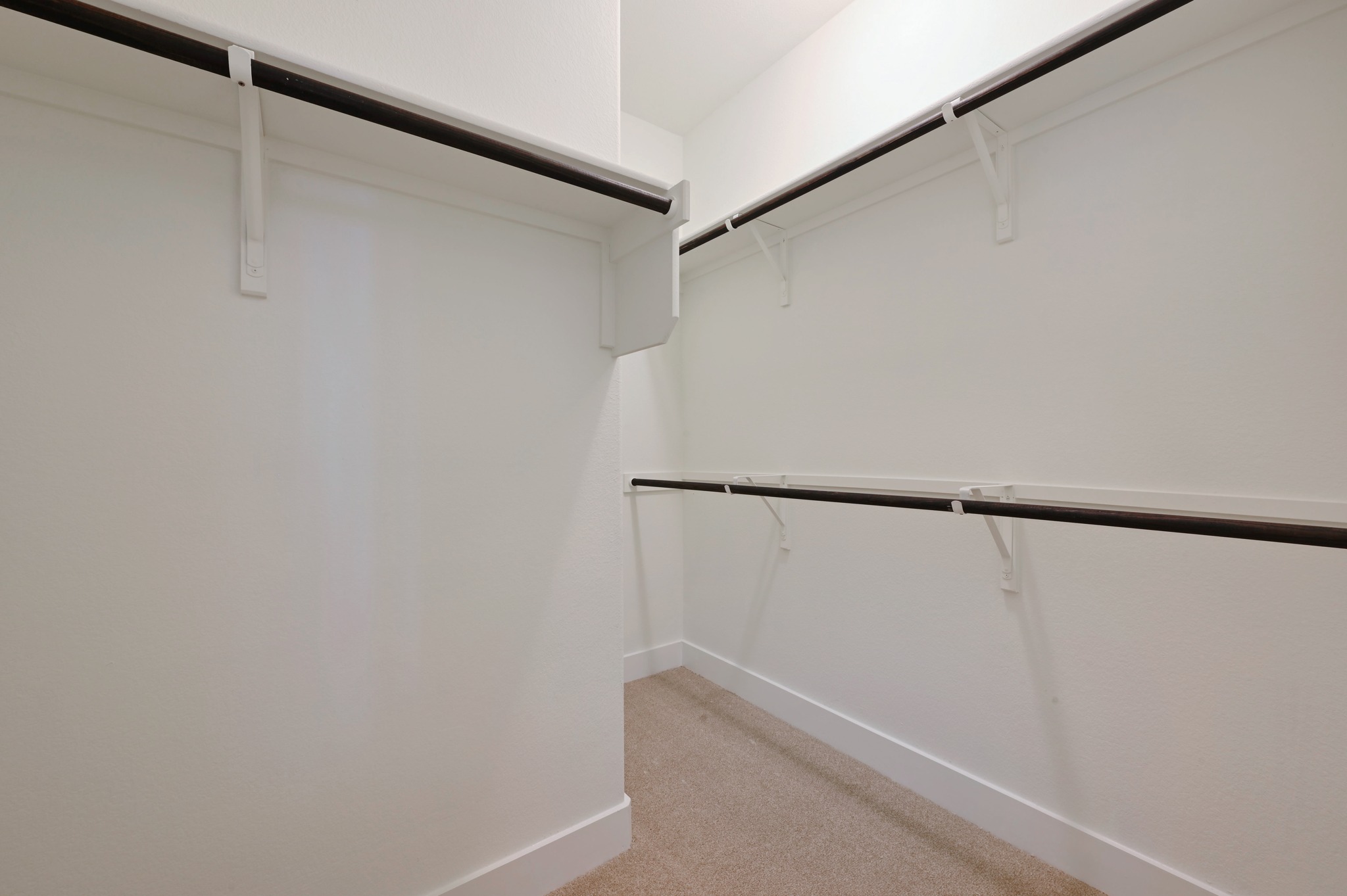 2204 Theseus Pass Austin, TX 78741 - Photo 18 of 31 a view of walk in closet with empty racks