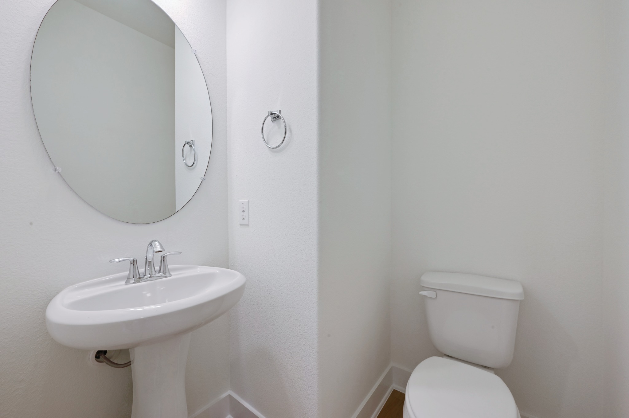2204 Theseus Pass Austin, TX 78741 - Photo 19 of 31 a bathroom with a toilet sink and mirror