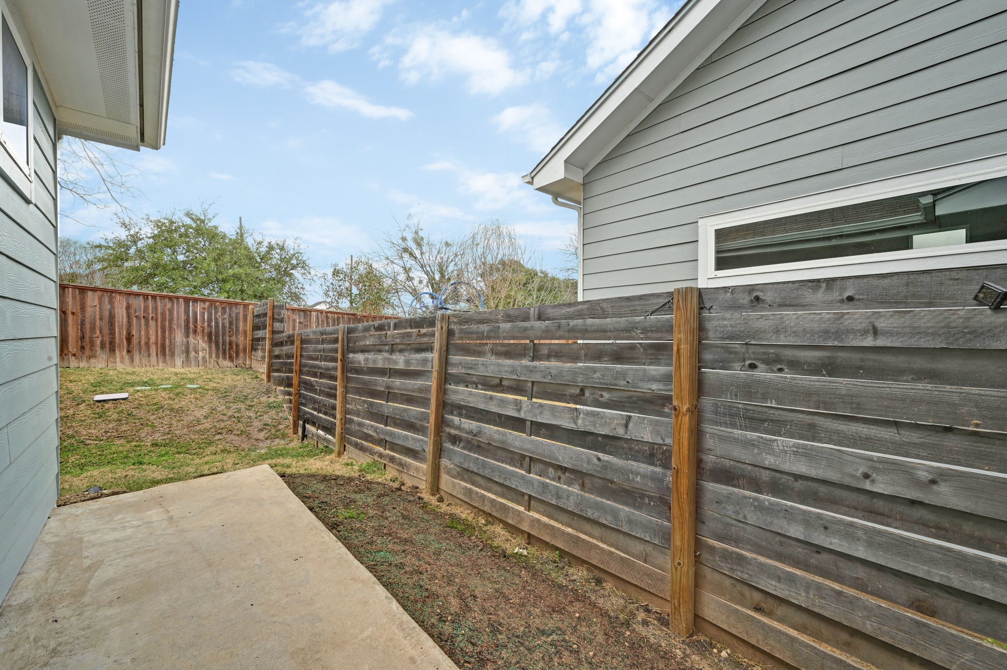 2204 Theseus Pass Austin, TX 78741 - Photo 27 of 31 a view of a house with a wooden fence