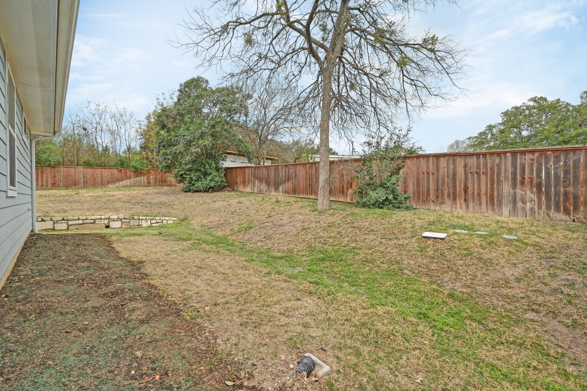 2204 Theseus Pass Austin, TX 78741 - Photo 28 of 31 a view of a backyard with wooden fence