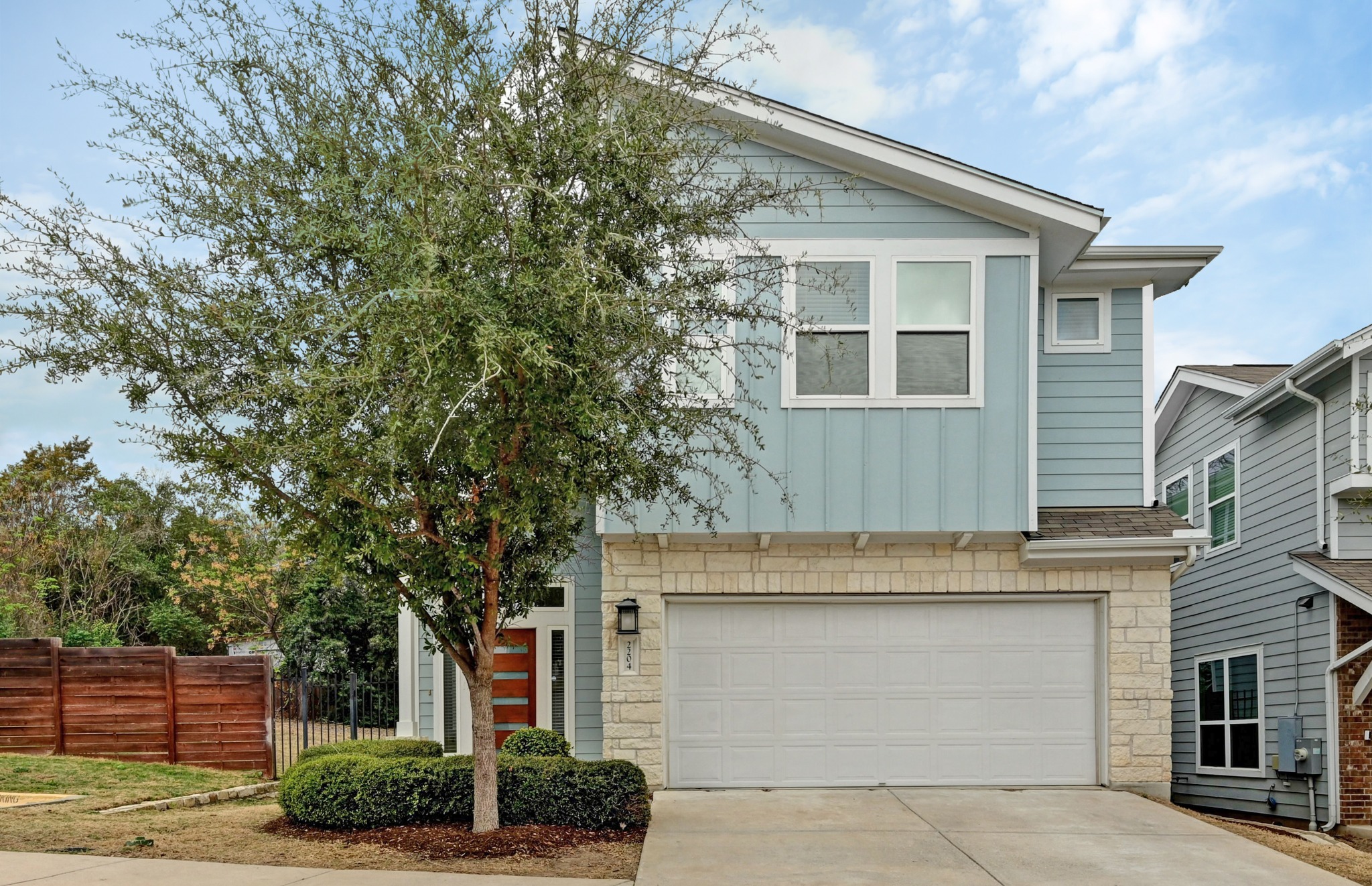 2204 Theseus Pass Austin, TX 78741 - Photo 3 of 31 front view of house with a tree