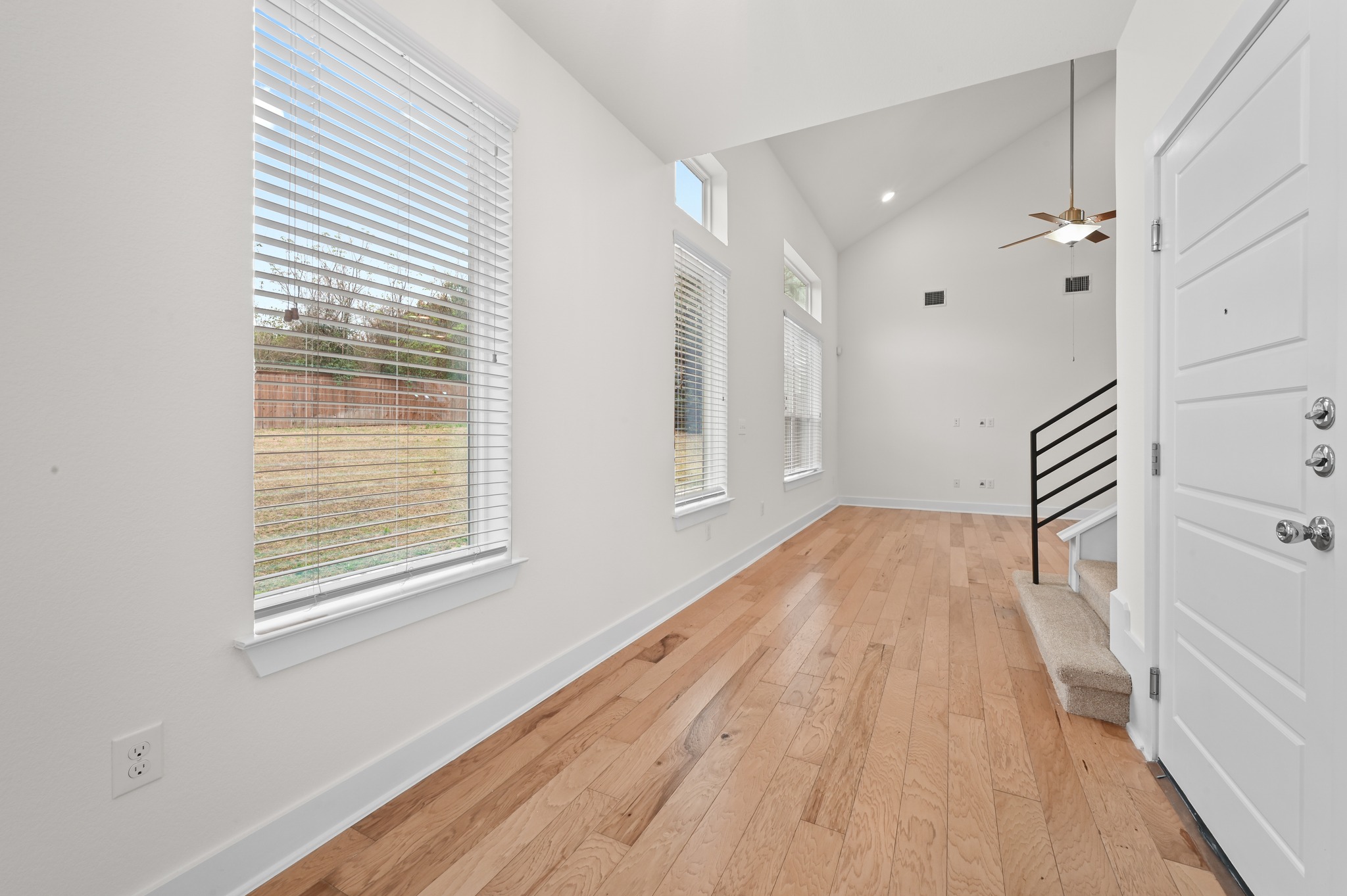 2204 Theseus Pass Austin, TX 78741 - Photo 4 of 31 wooden floor in an empty room with a window