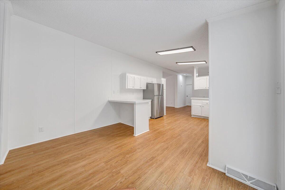 822 Buck Run Drive Critz, VA 24082 - Photo 18 of 55 a view of empty room with wooden floor