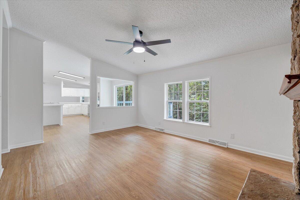 822 Buck Run Drive Critz, VA 24082 - Photo 22 of 55 a view of an empty room with a window and wooden floor