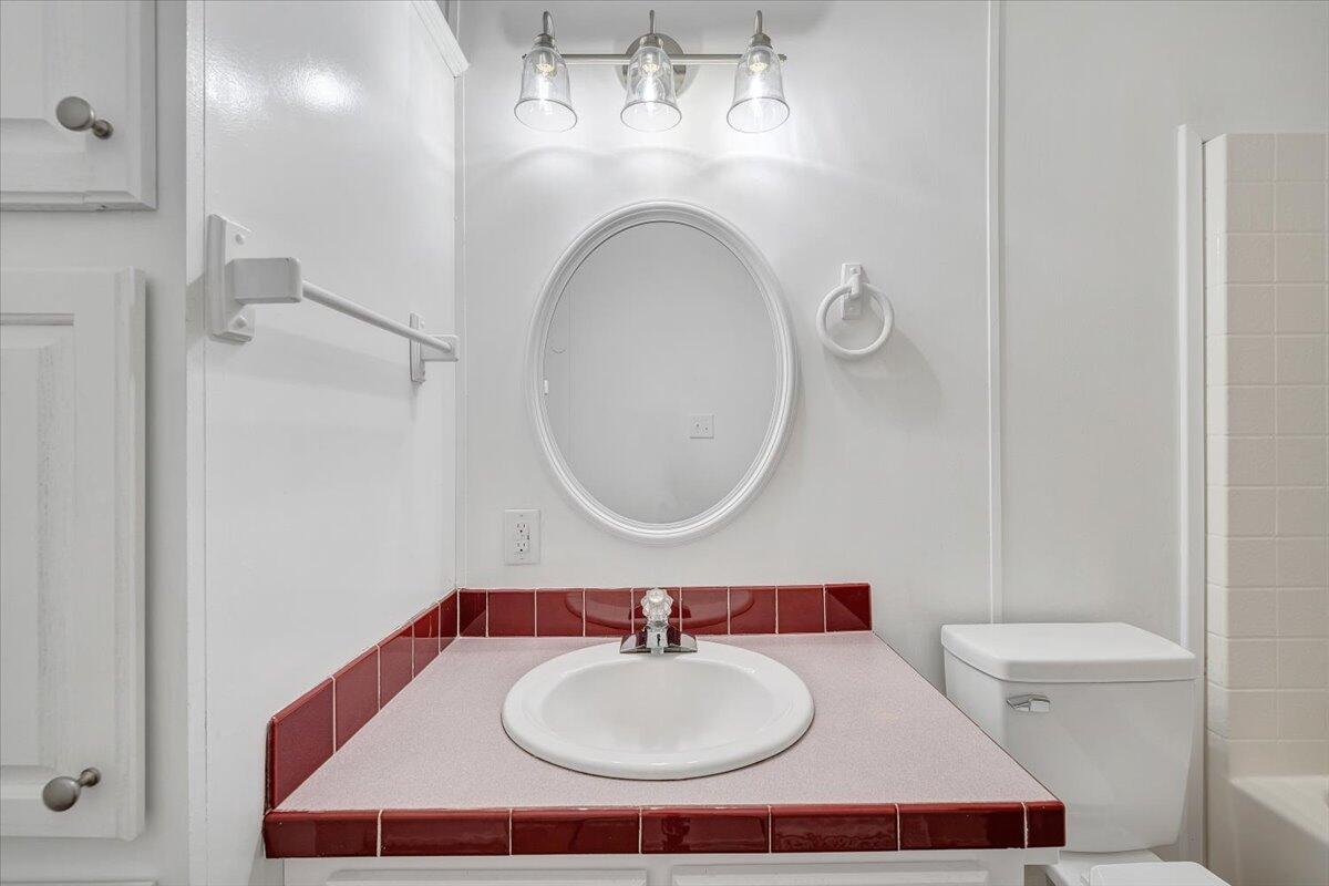 822 Buck Run Drive Critz, VA 24082 - Photo 29 of 55 a bathroom with a sink and a mirror