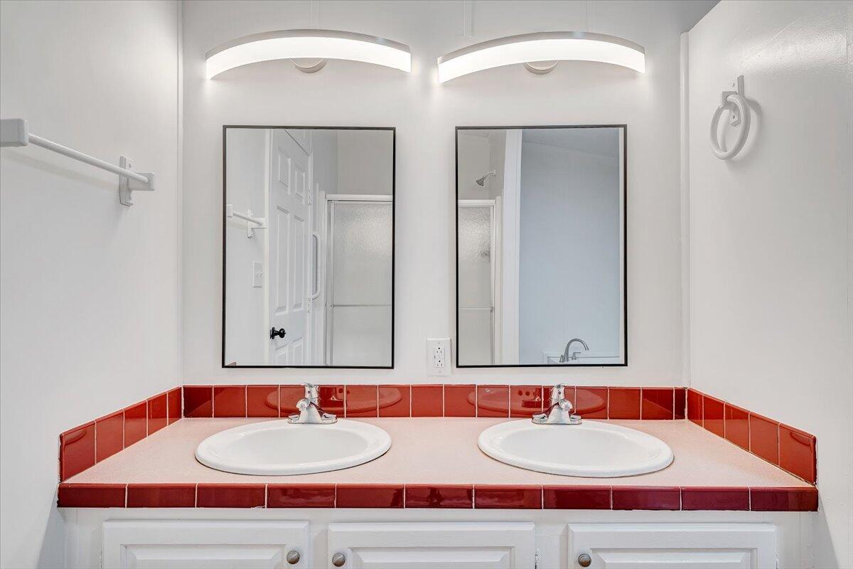 822 Buck Run Drive Critz, VA 24082 - Photo 39 of 55 a bathroom with double vanity sinks and a mirror