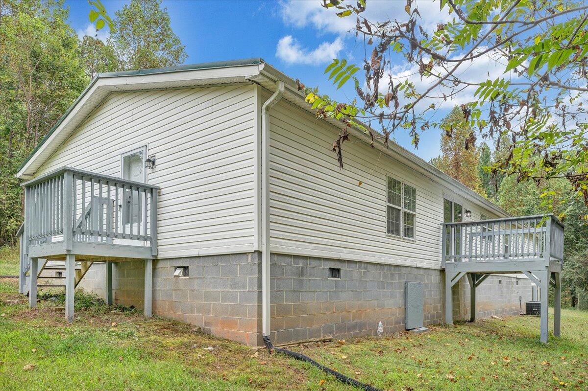 822 Buck Run Drive Critz, VA 24082 - Photo 49 of 55 a small white building with a white roof and a table and chair