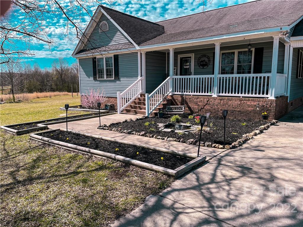 270 Tom Laney Road Lancaster, SC 29720 - Photo 2 of 28 a front view of a house with garden