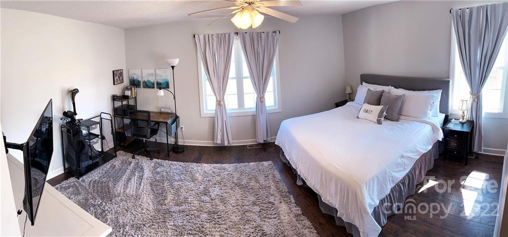 270 Tom Laney Road Lancaster, SC 29720 - Photo 22 of 28 a spacious bedroom with a bed and a flat tv screen on the dresser