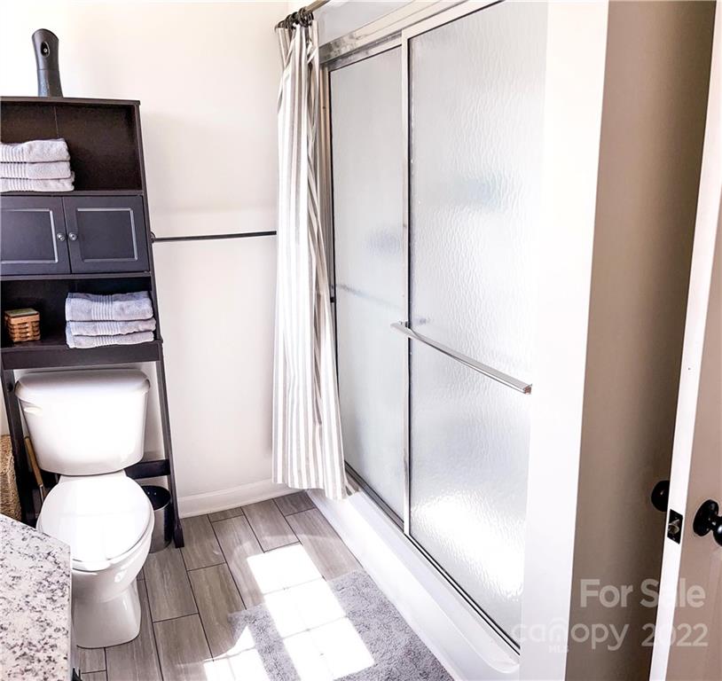 270 Tom Laney Road Lancaster, SC 29720 - Photo 24 of 28 a bathroom with a toilet and a shower