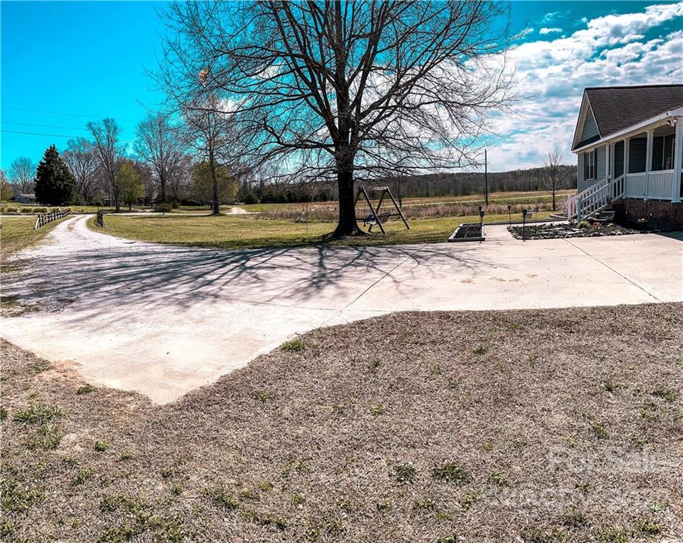 270 Tom Laney Road Lancaster, SC 29720 - Photo 4 of 28 a view of a yard with a large tree