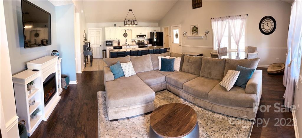 270 Tom Laney Road Lancaster, SC 29720 - Photo 8 of 28 a living room with furniture a flat screen tv and a fireplace