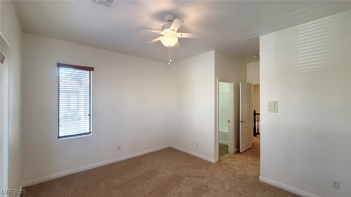 5913 Altissimo Street North Las Vegas, NV 89081 - Photo 27 of 37 Spare room featuring light colored carpet and ceiling fan