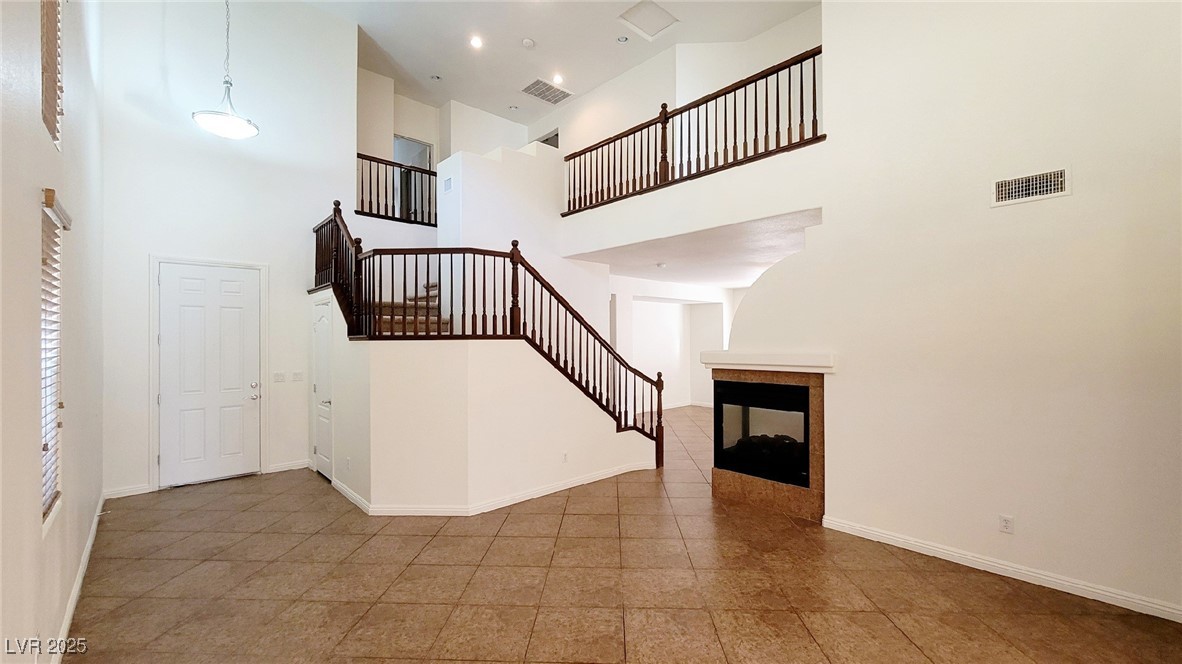 5913 Altissimo Street North Las Vegas, NV 89081 - Photo 6 of 37 Foyer entrance featuring a towering ceiling and stairs