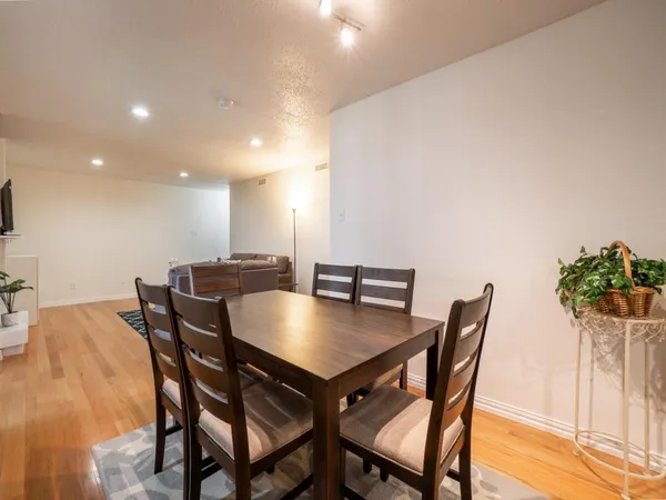 a living room with furniture and a table