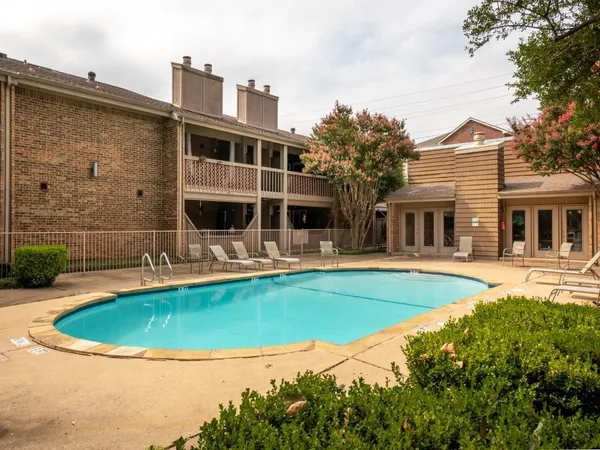 a view of a house with swimming pool