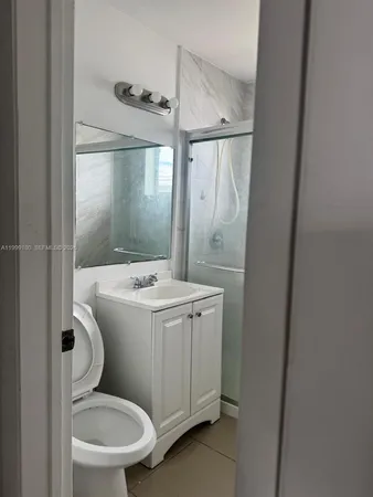 a bathroom with a sink and toilet