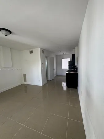 a view of a kitchen with a sink cabinets and a window