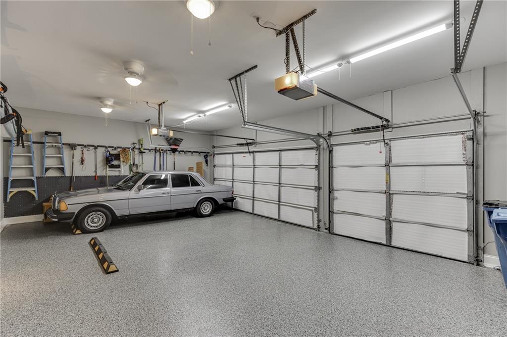 2758 Pathview Drive Dacula, GA 30019 - Photo 21 of 48 a view of a garage with cars