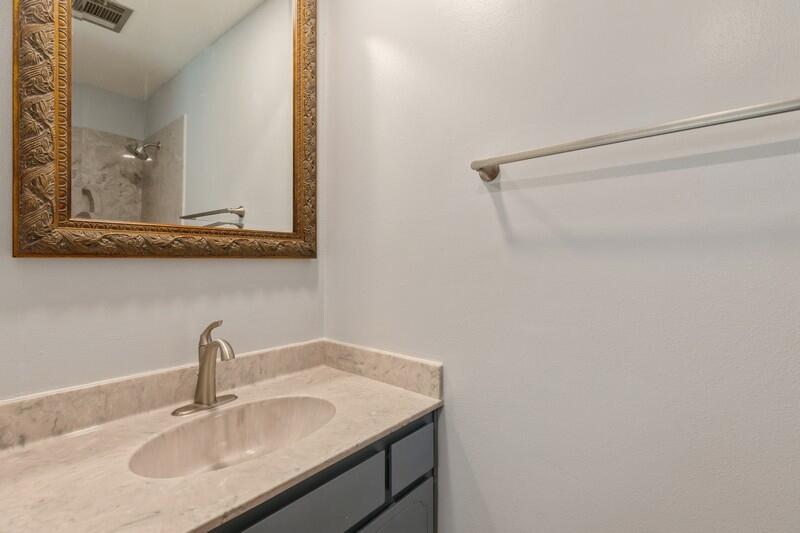 1086 County Highway 183 North DeFuniak Springs, FL 32433 - Photo 18 of 39 a bathroom with a sink and a mirror