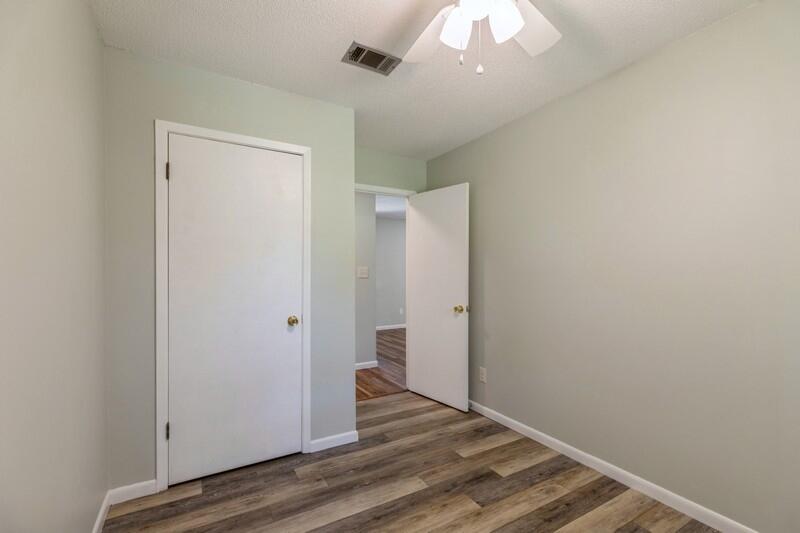 1086 County Highway 183 North DeFuniak Springs, FL 32433 - Photo 21 of 39 a view of an empty room with wooden floor