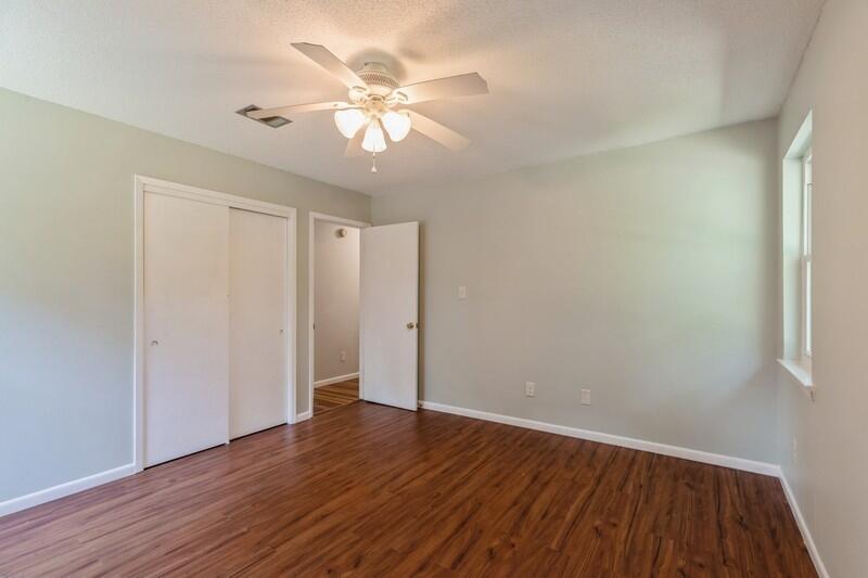 1086 County Highway 183 North DeFuniak Springs, FL 32433 - Photo 24 of 39 a view of an empty room with wooden floor