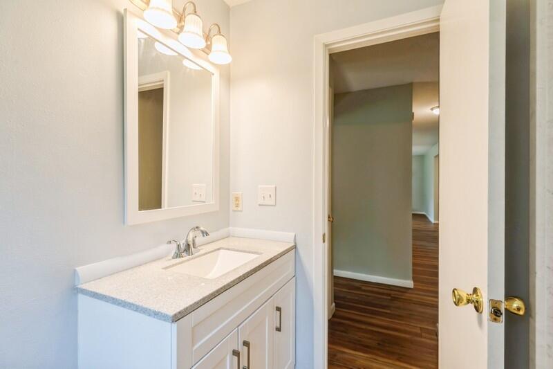 1086 County Highway 183 North DeFuniak Springs, FL 32433 - Photo 27 of 39 a bathroom with a sink and a mirror