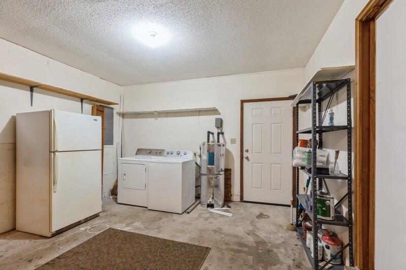 1086 County Highway 183 North DeFuniak Springs, FL 32433 - Photo 29 of 39 a view of storage and utility room with refrigerator washer and dryer