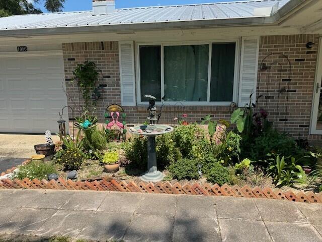 1086 County Highway 183 North DeFuniak Springs, FL 32433 - Photo 3 of 39 a view of a house with potted plants