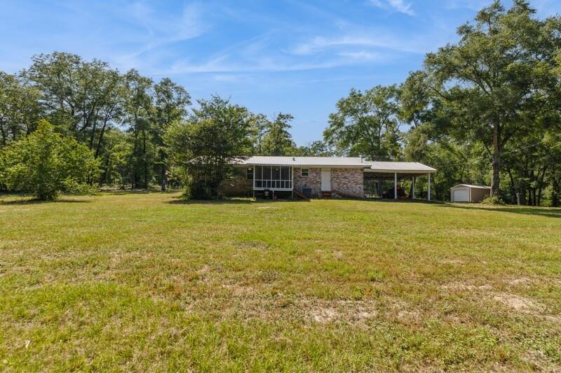 1086 County Highway 183 North DeFuniak Springs, FL 32433 - Photo 33 of 39 a view of a house with a yard