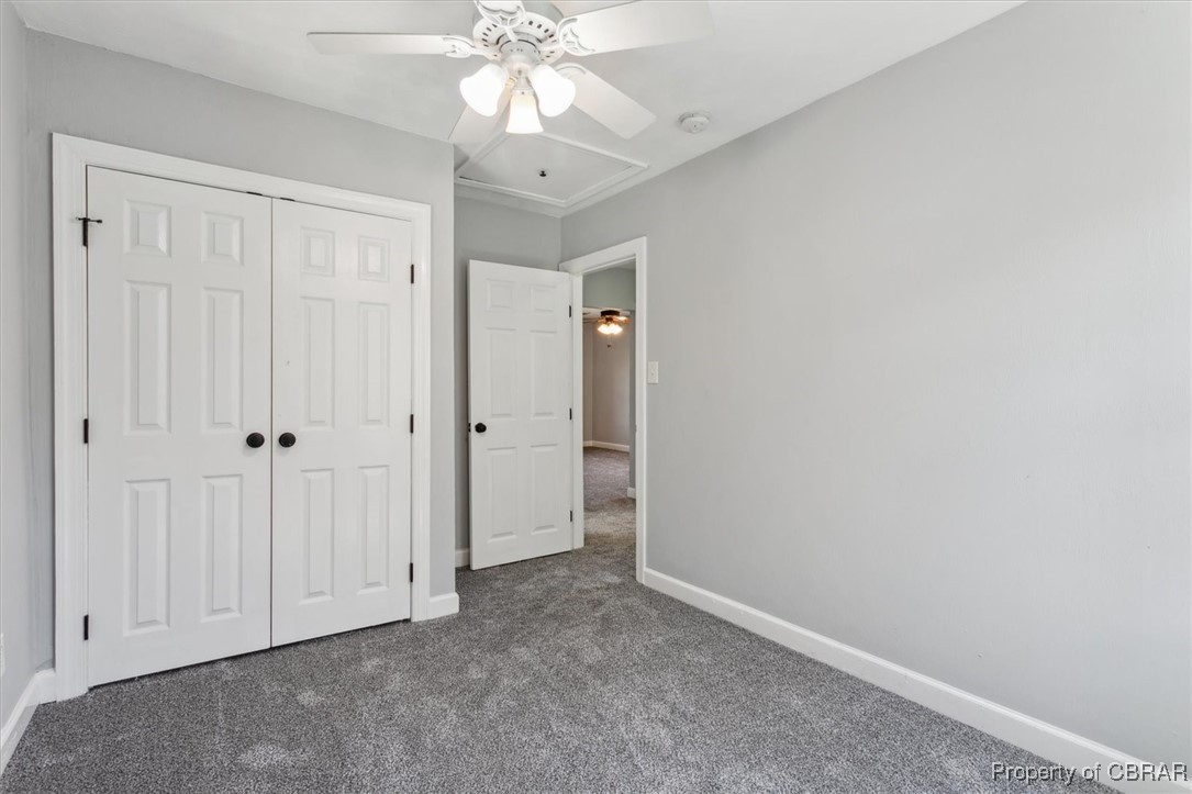 3810 Kecoughtan Road Hampton, VA 23669 - Photo 27 of 40 Unfurnished bedroom featuring a closet, ceiling fan, and carpet flooring