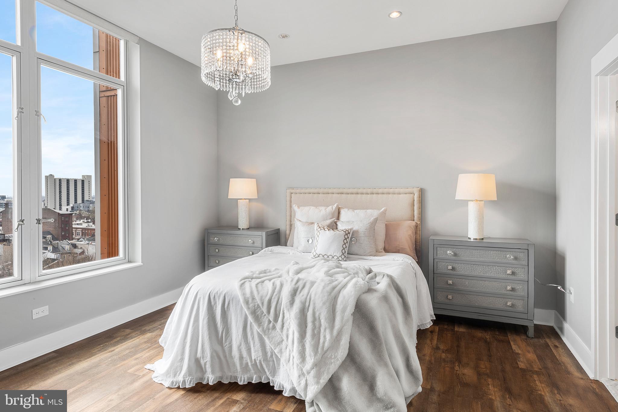 1101 Locust Street, Unit 8B Philadelphia, PA 19107 - Photo 18 of 36 a bedroom with a bed and a window