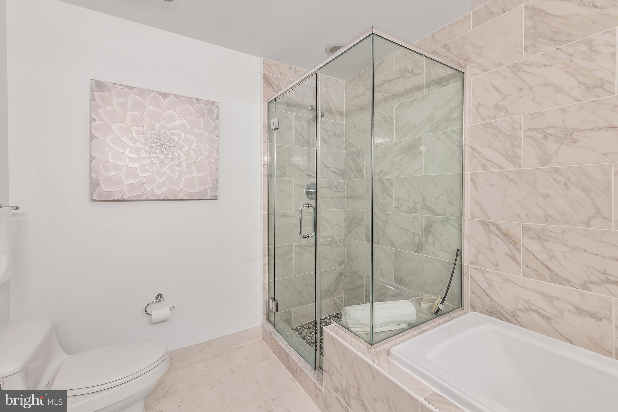 1101 Locust Street, Unit 8B Philadelphia, PA 19107 - Photo 22 of 36 a bathroom with a shower and toilet