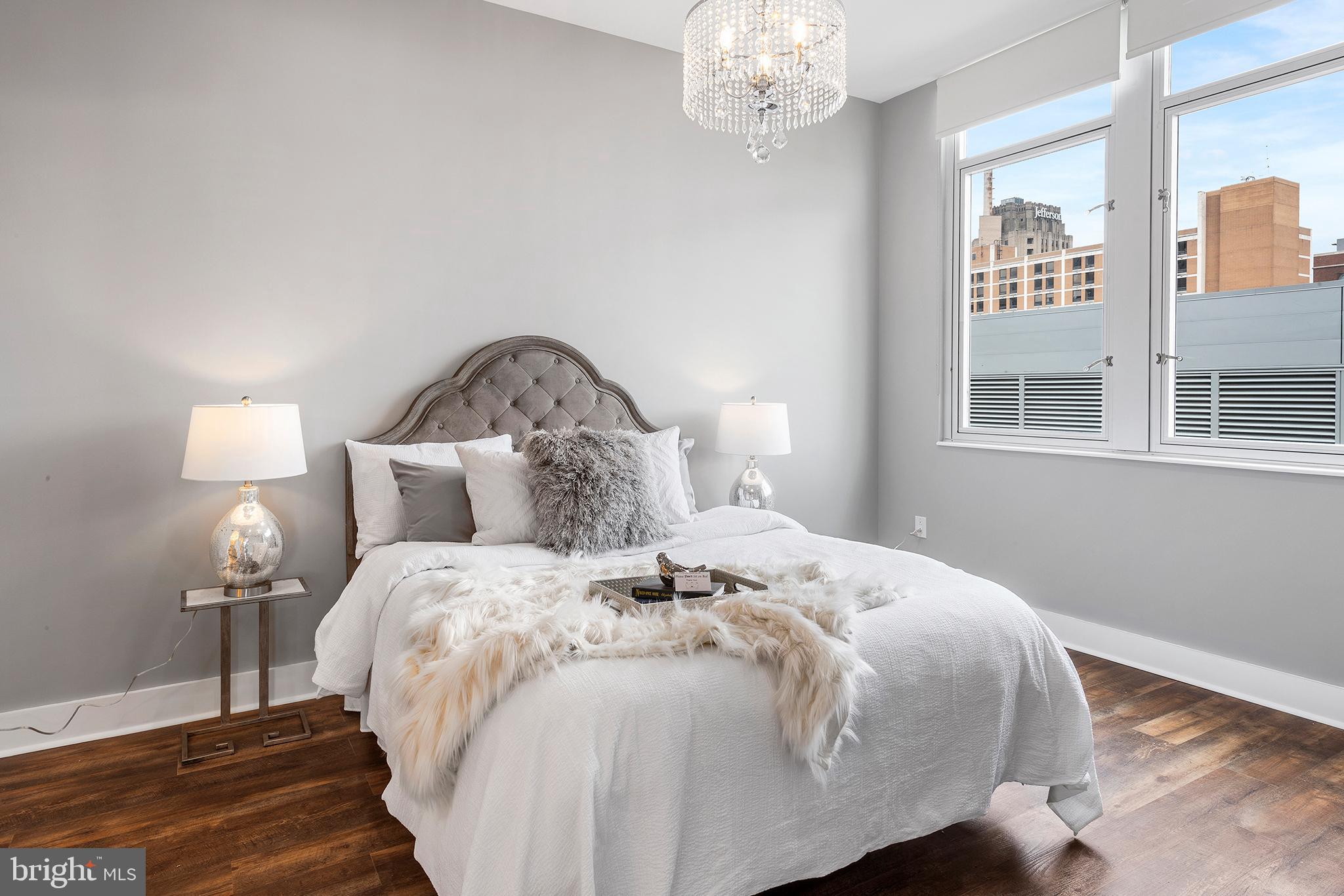 1101 Locust Street, Unit 8B Philadelphia, PA 19107 - Photo 28 of 36 a bedroom with a bed and a window