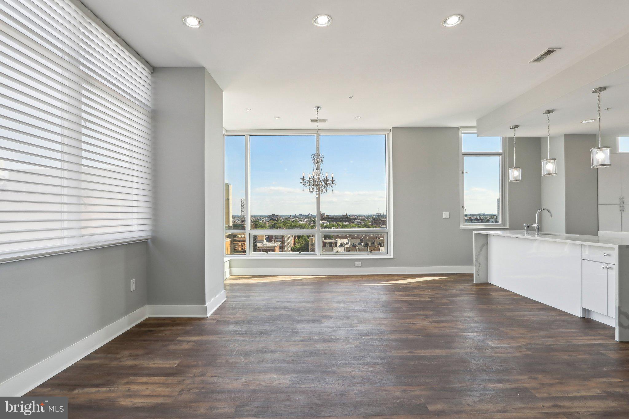 1101 Locust Street, Unit 8B Philadelphia, PA 19107 - Photo 3 of 36 Open Living/Dining w enormous windows