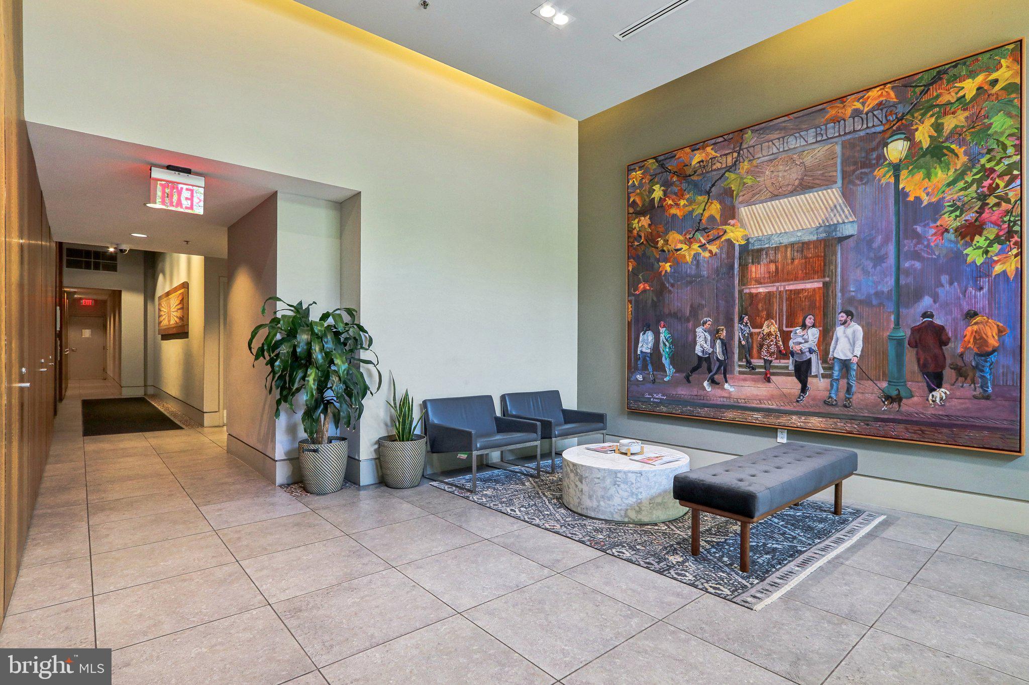 1101 Locust Street, Unit 8B Philadelphia, PA 19107 - Photo 35 of 36 a living room with furniture and flowers
