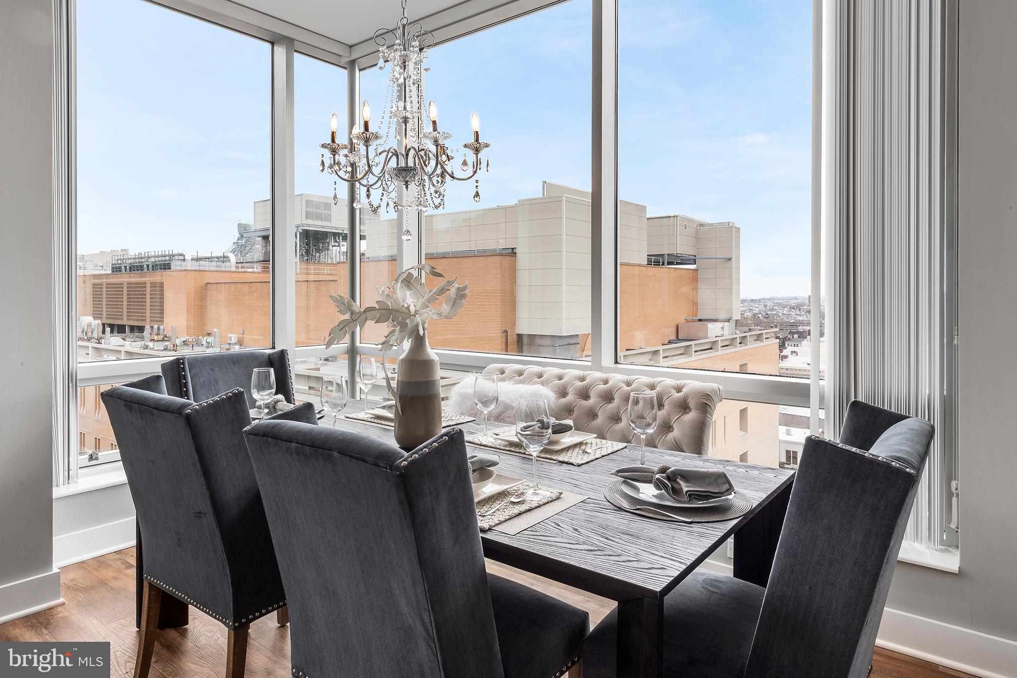 1101 Locust Street, Unit 8B Philadelphia, PA 19107 - Photo 5 of 36 a view of a dining room with furniture window and outside view