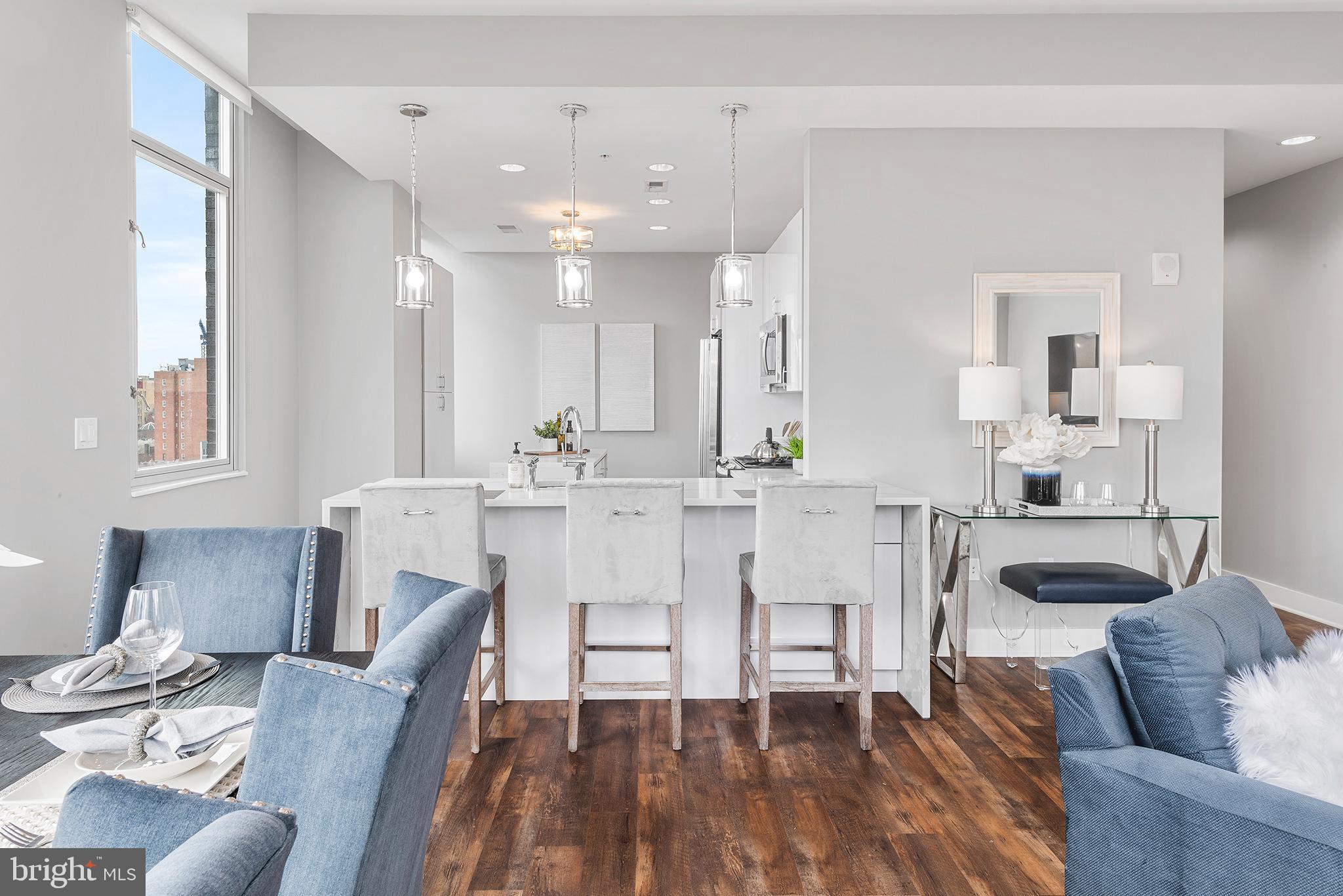 1101 Locust Street, Unit 8B Philadelphia, PA 19107 - Photo 7 of 36 a dining room with furniture and wooden floor