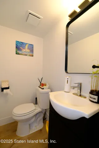 a bathroom with a toilet a sink and shower