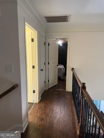 a view of hallway with wooden floor