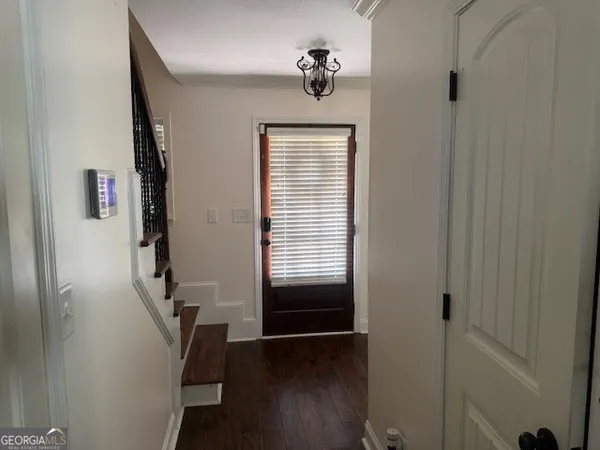 a view of entryway with wooden floor
