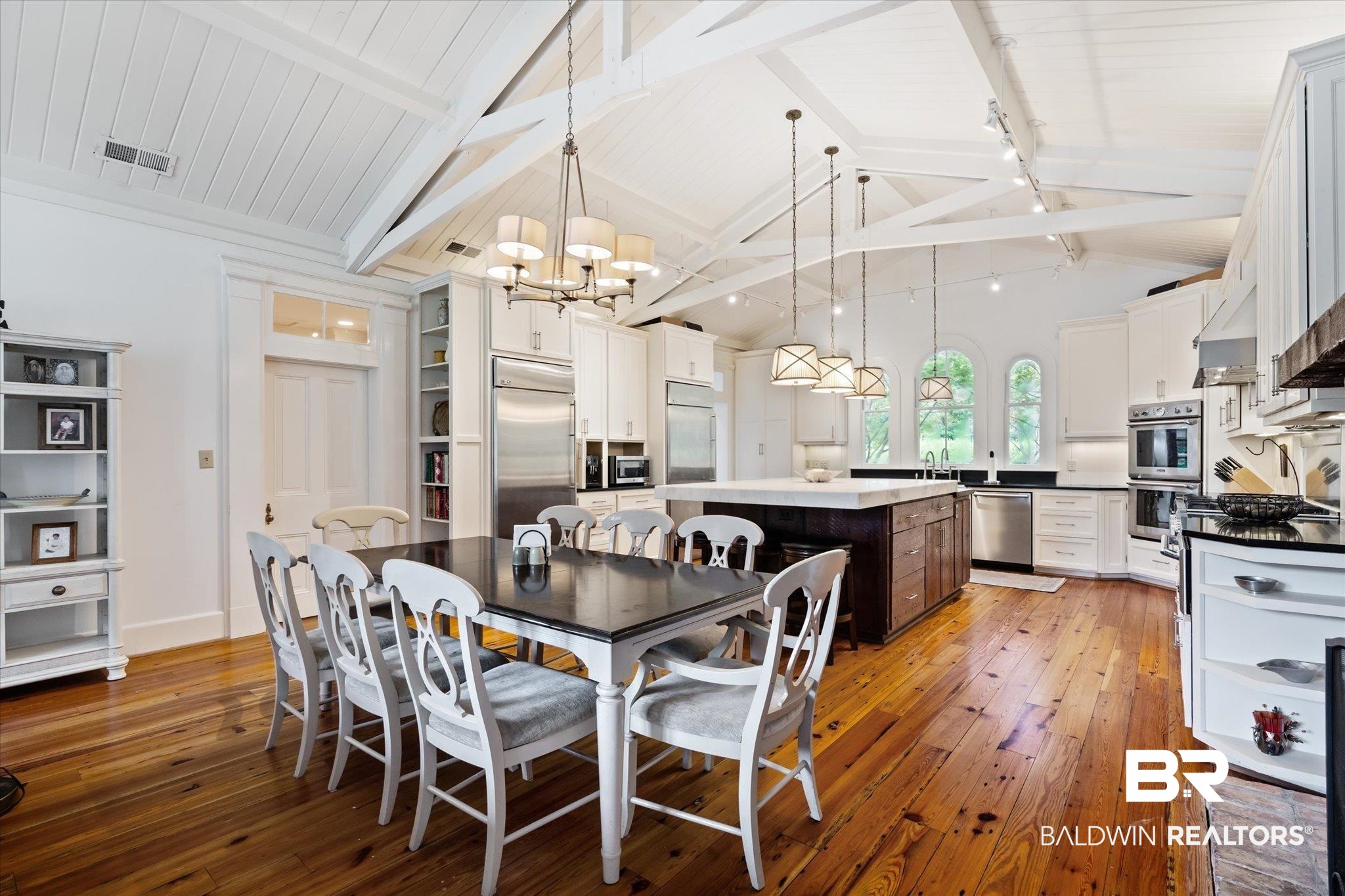2205 Spring Hill Avenue Mobile, AL 36607 - Photo 14 of 59 Dining area featuring a notable chandelier, hardwood / wood-style flooring, high vaulted ceiling, sink, and beam ceiling