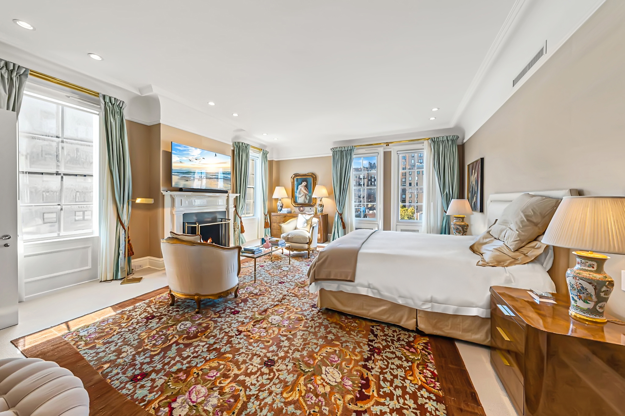 32 East 64th Street, Unit 9W Manhattan, NY 10065 - Photo 10 of 16 a living room with furniture and a large window
