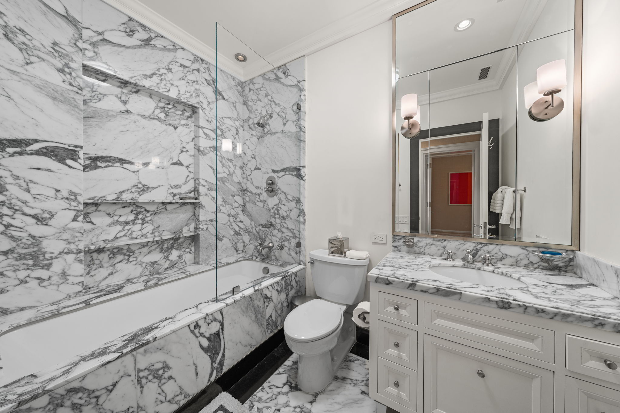 32 East 64th Street, Unit 9W Manhattan, NY 10065 - Photo 15 of 16 a bathroom with a granite countertop sink toilet and shower