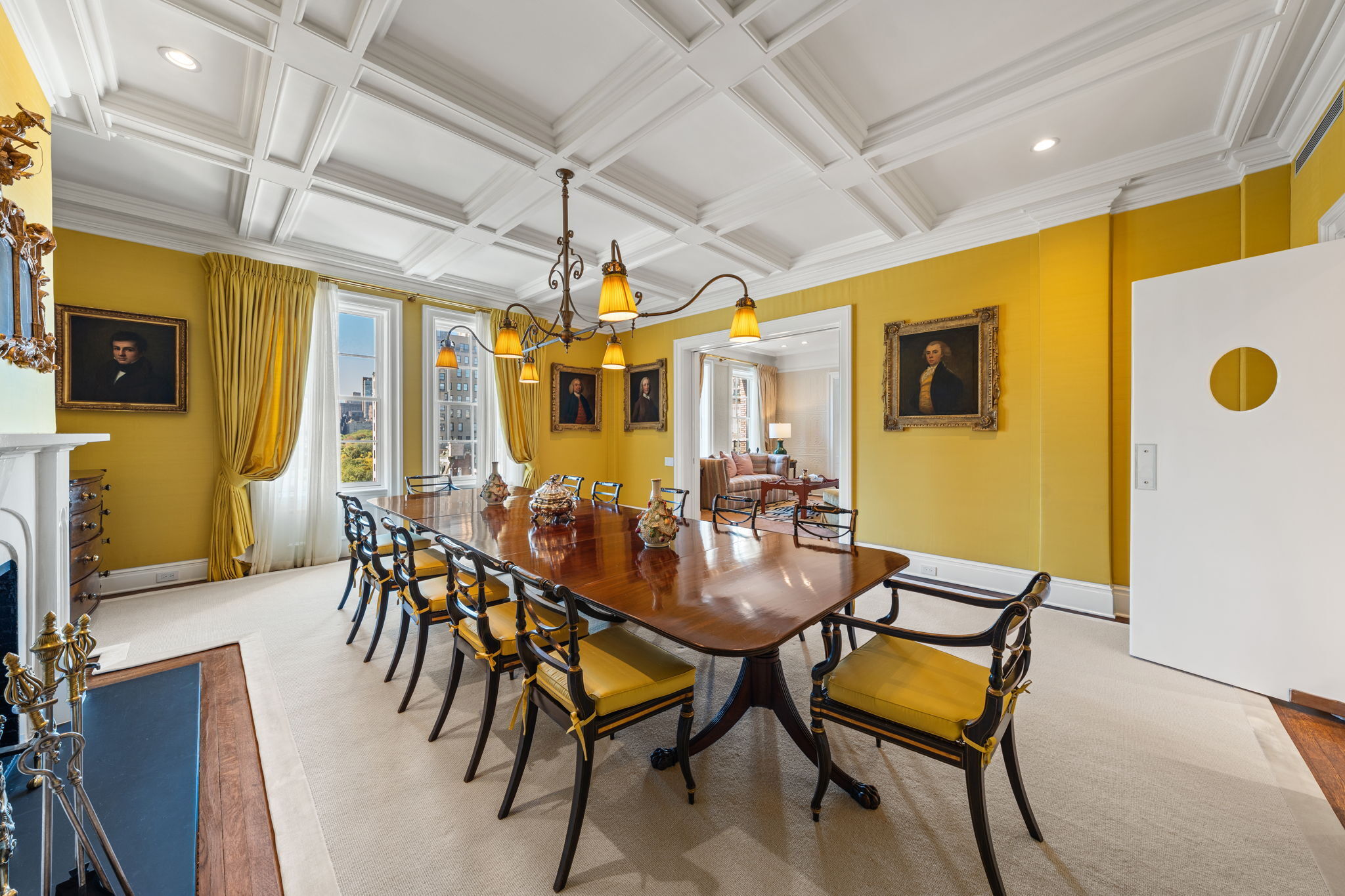 32 East 64th Street, Unit 9W Manhattan, NY 10065 - Photo 6 of 16 a view of a dining room with furniture and a chandelier