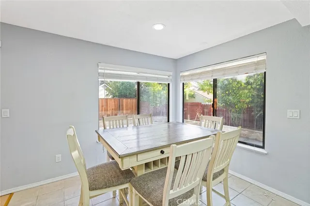 a view of a livingroom with an empty space and a ceiling fan