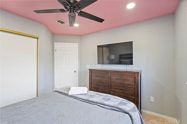 a bathroom with a white bath tub sitting next to a window