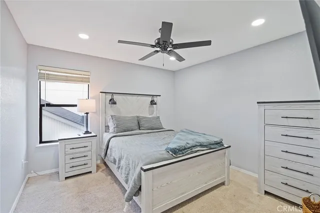 a view of a patio with table and chairs next to a yard