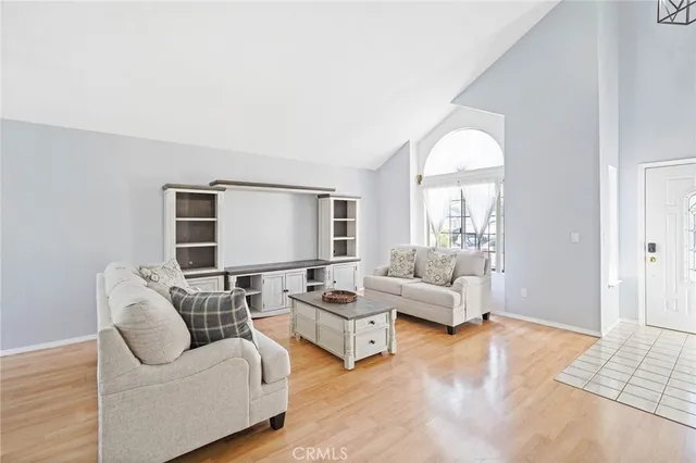 a living room with furniture and a table