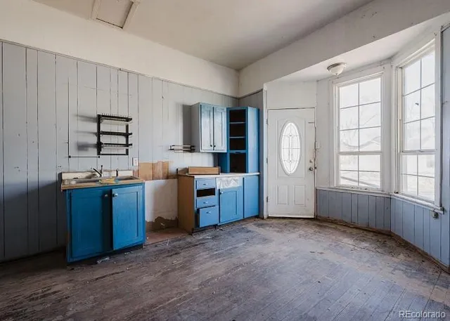 a view of an empty room and a window